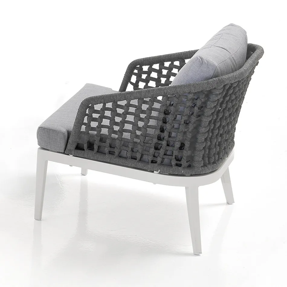 Sala interior e exterior com 2 poltronas, 1 sofá e 1 mesa de centro - Sortir Viadurini