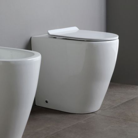 Vaso sanitário de cerâmica Oleander com descarga deslizante e assento com fechamento suave. Viadurini