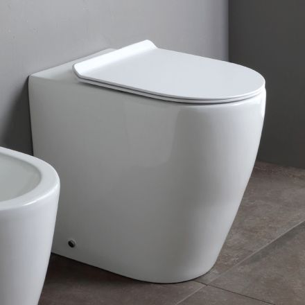 Vaso sanitário sem aro com assento cerâmico termoendurecido de fechamento suave - Oleandro Viadurini