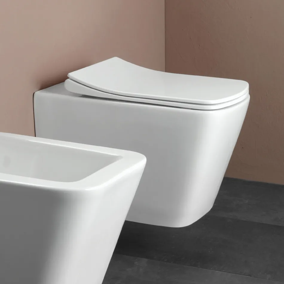 Sanitário suspenso com assento cerâmico de fecho suave e design moderno - Giunco Viadurini
