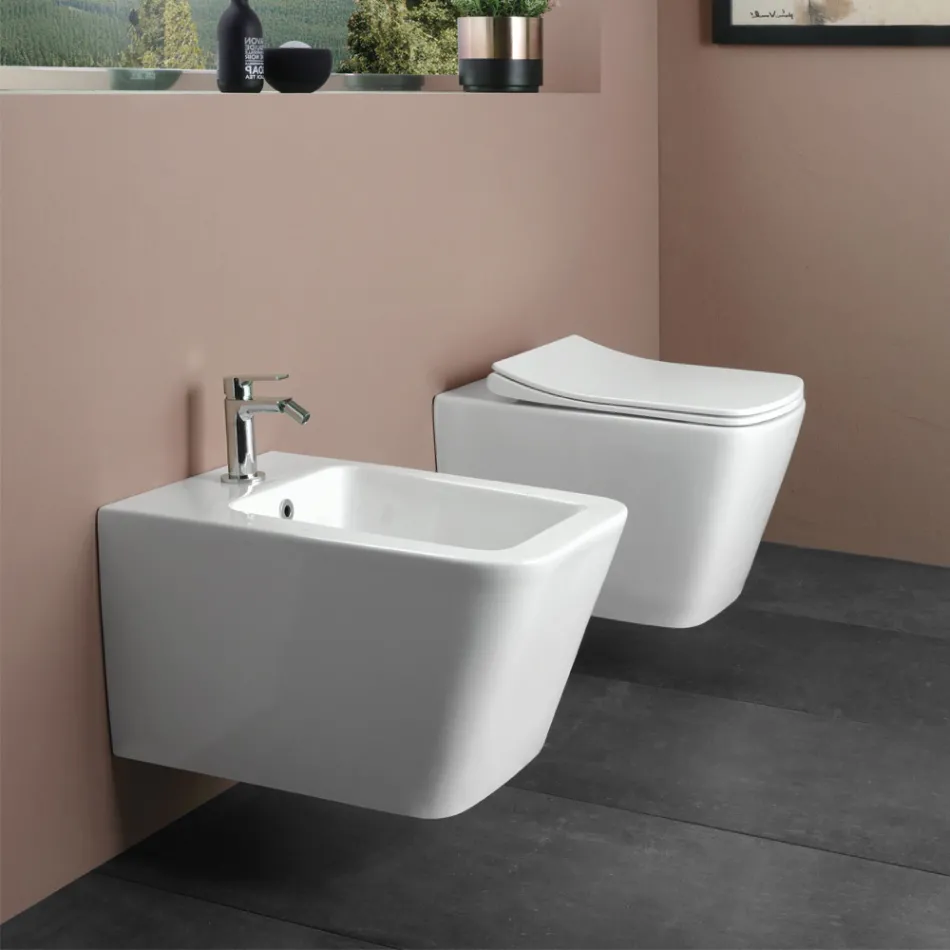 Sanitário suspenso com assento cerâmico de fecho suave e design moderno - Giunco Viadurini