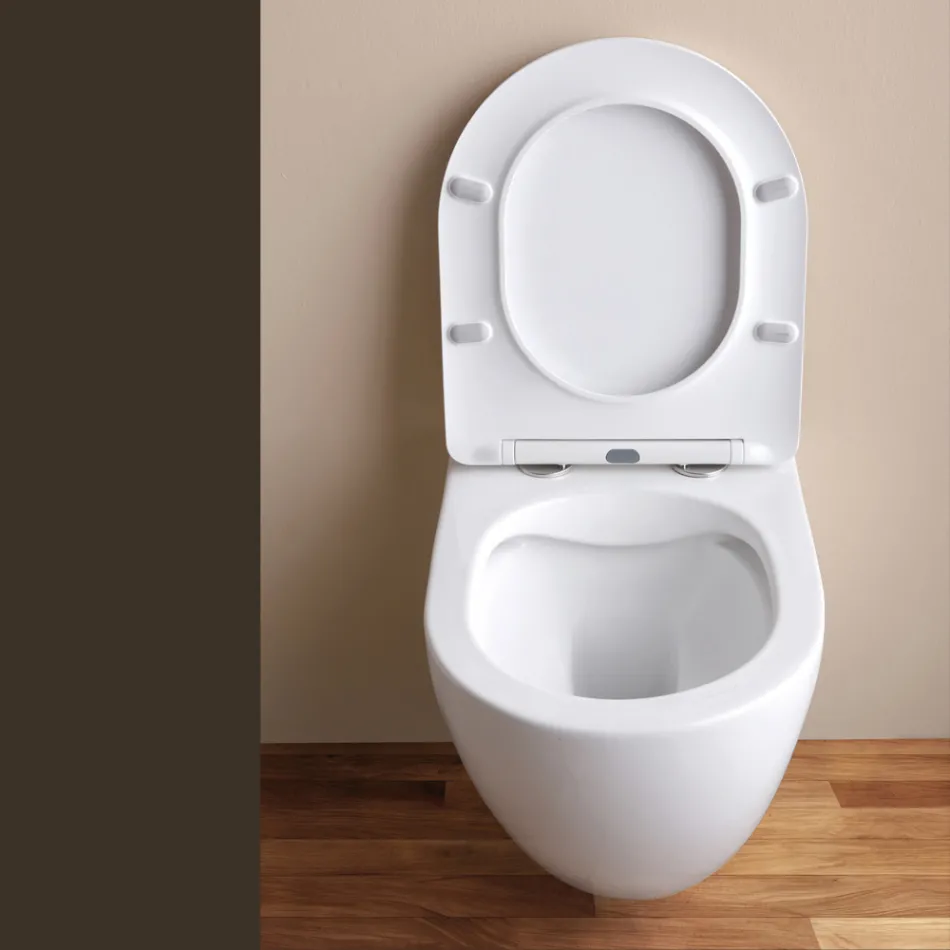 Vaso sanitário suspenso sem aro com assento cerâmico de fechamento suave - Juniper   Viadurini