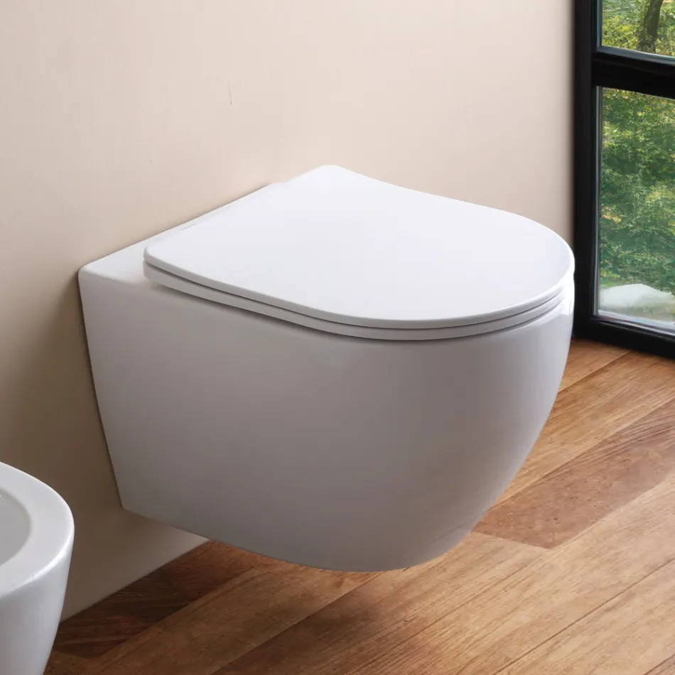 Vaso sanitário suspenso sem aro com assento cerâmico de fechamento suave - Juniper   Viadurini